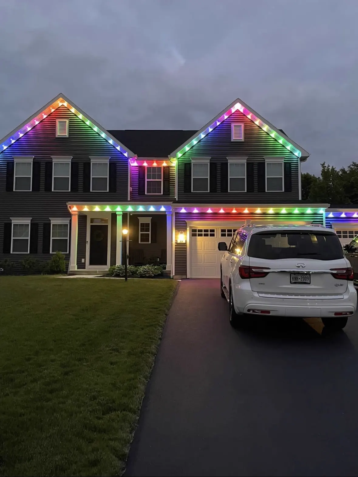 Holiday lighting install on a Rochester home roofline